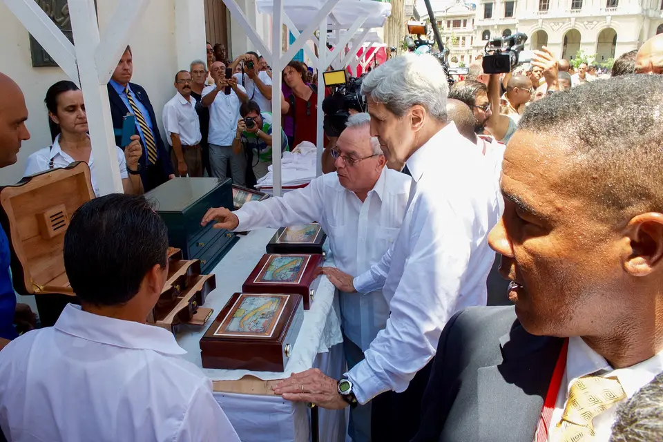 Secretary kerry looks at a cigar humidor from a